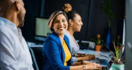 Woman smiles after seeing video for health benefits